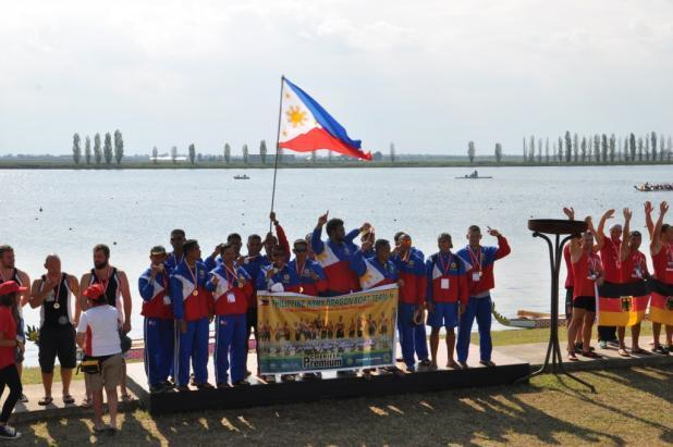 The Philippine Army Dragon Boat Team raises the Philippine flag for their gold medal win in the small boat category (200m) at the International Dragon Boat Federation Club Crew Championship held in Ravenna, Italy on September 5, 2014 Photo by Giorgo Minestrini 